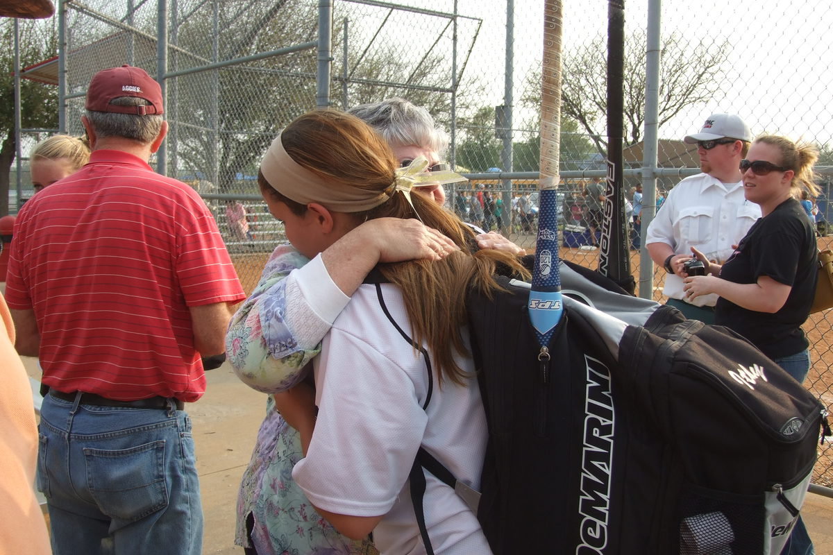 Image: Paige Westbrook(10) hugs her grandmother after Italy’s 24-3 win over Faith Family.
