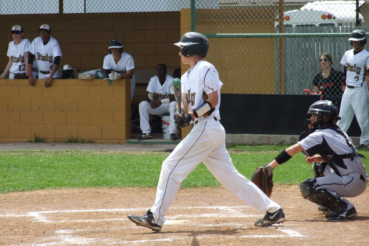 Image: Freshman Ryan Connor(17) hits the ball into play for Italy.