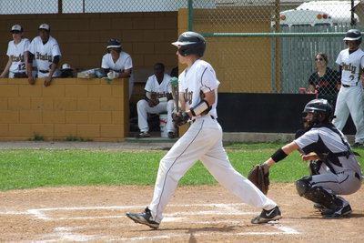 Image: Freshman Ryan Connor(17) hits the ball into play for Italy.