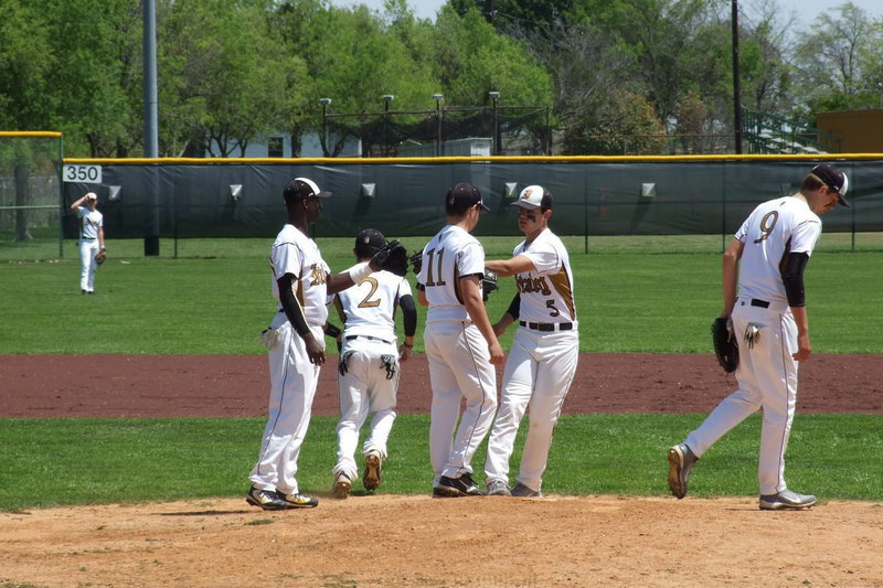 Image: Good luck Tyler! Tyler Anderson(11) gets love taps from his Gladiator teammates Marvin Cox(3), Caden Jacinto(2), Reid Jacinto(5) and Cole Hopkins(9) to start the contest against ranked Dawson.