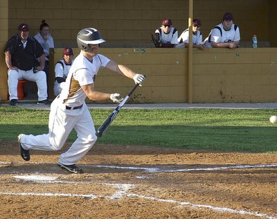 Image: Senior Chase Hamilton(10) bunts and then heads toward first base….