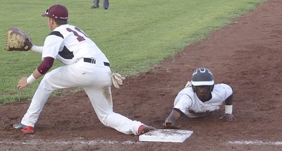 Image: Waxahachie Faith Family holds Marvin Cox(3) on the first base bag respecting the senior’s speed.