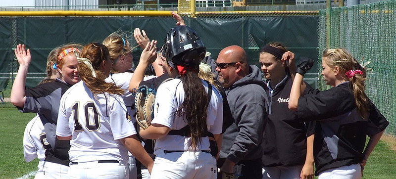 Image: Slap hands, slap hands! head coach Wayne Rowe joins his ladies in celebrating strong defensive play.