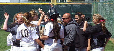 Image: Slap hands, slap hands! head coach Wayne Rowe joins his ladies in celebrating strong defensive play.