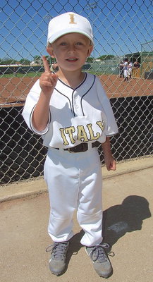Image: IYAA Gladiator Kace Campbell supports the Lady Gladiators and his aunts, Madison and Hannah Washington.