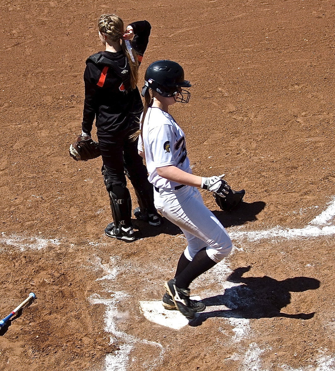 Image: Madison Washington(2) steps on home plate.