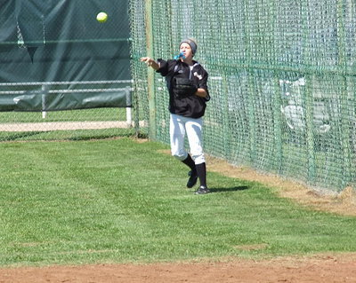 Image: Right fielder Britney Chambers(4) covers an overthrow past first base. The hustle by Chambers and her defensive teammates paid off with the Lady Gladiators recording a 9-0 win over Ferris.