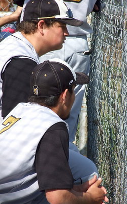Image: Italy’s John Byers(18) and Tyler Anderson(7) watch the action from the dugout.
