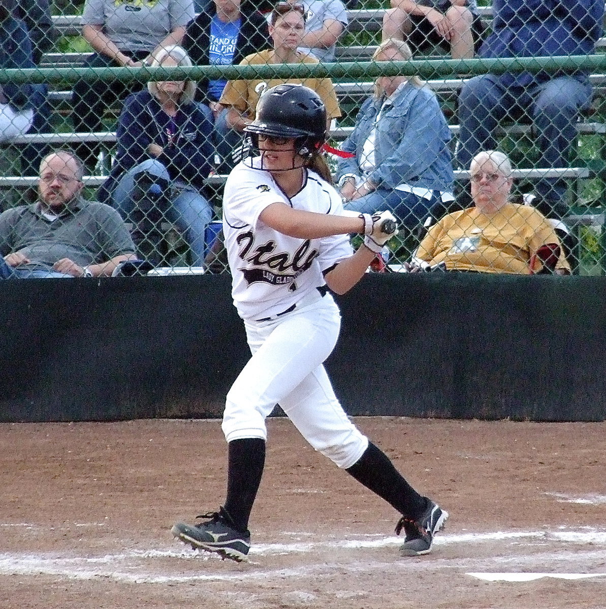 Image: Sophomore slap hitter Bailey Eubank(1) works to get on base with mom Sandy Eubank, who is located directly above Bailey, rooting her on from the bleachers.