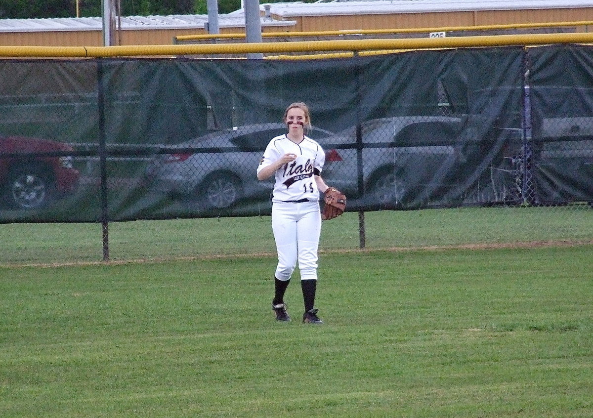 Image: Italy center fielder Kelsey Nelson(14) reminds us that sometimes, their just aren’t enough sunflower seeds…
