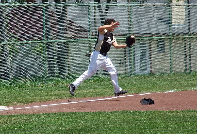 Image: Chace McGinnis(8) turns a routine catch into a thing of beauty at third base for an Italy out.