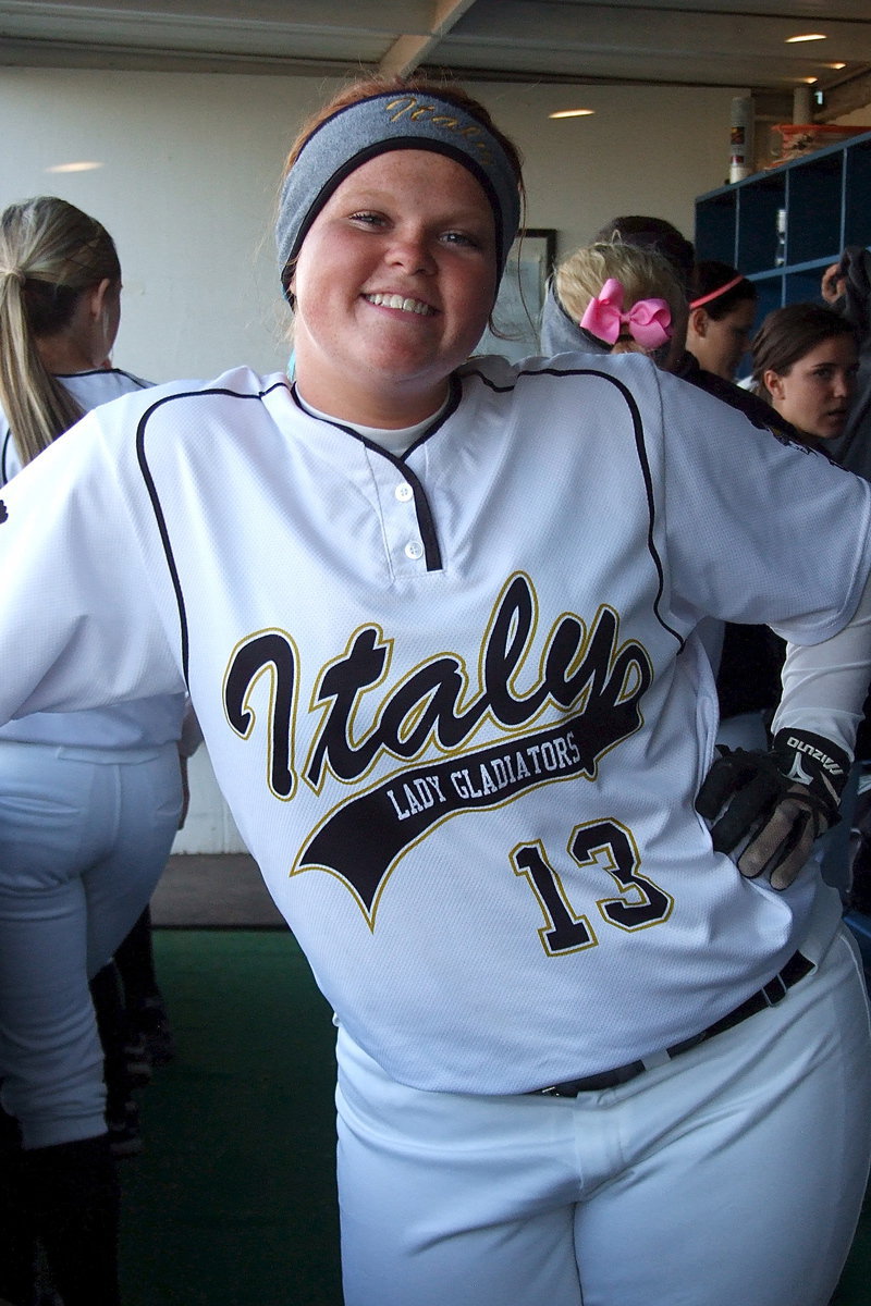 Image: Senior Katie Byers(13) is all smiles after her and her Lady Gladiator teammates dispose of Gorman in the Area round of the 2013 1A UIL Playoffs.