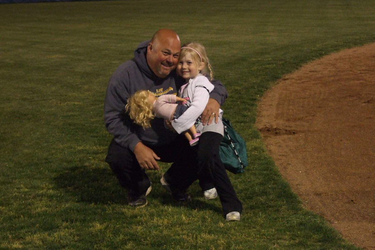 Image: Lady Gladiator head coach Wayne Rowe receives a congratulatory hug from daughter Hannah after Italy beat Gorman for the Area Championship.