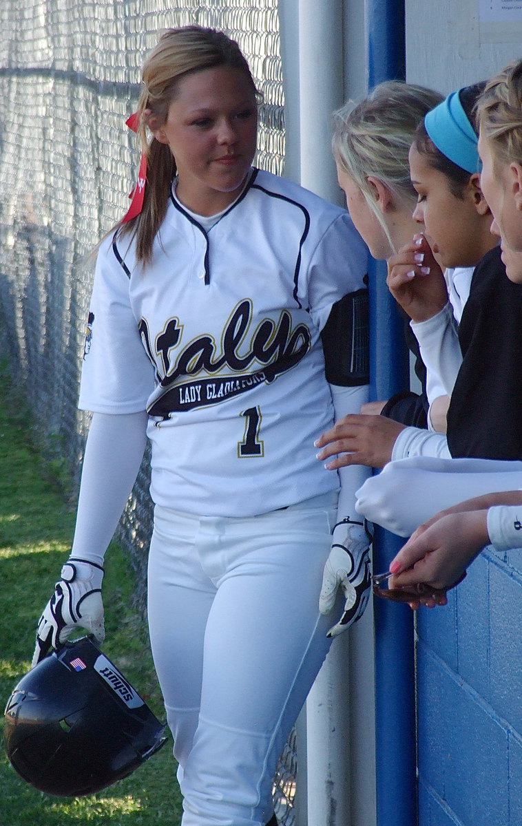 Image: Bailey Eubank(1) chats with her teammates before going to bat.
