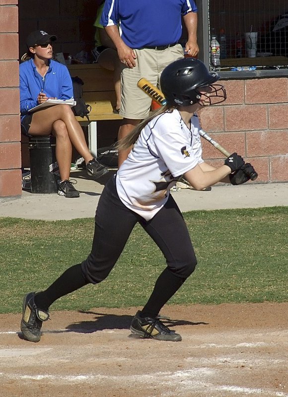 Image: Kelsey Nelson(14) hits the ball to move runners for Italy.