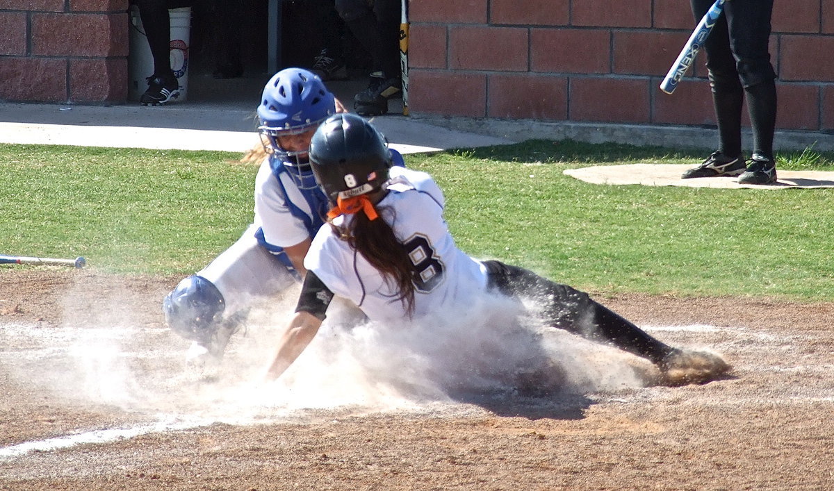 Image: Lady Gladiator senior Morgan Cockerham(8) tries to beat the throw home but Bosqueville’s catcher makes the tag for an out.