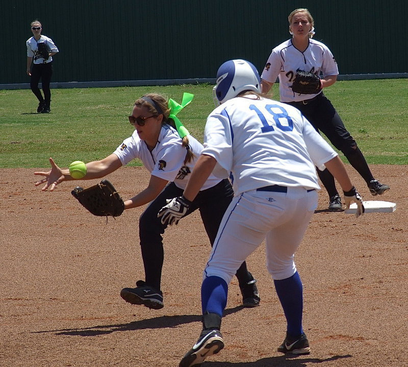 Image: Bailey Eubank(1) brings in a grounder.