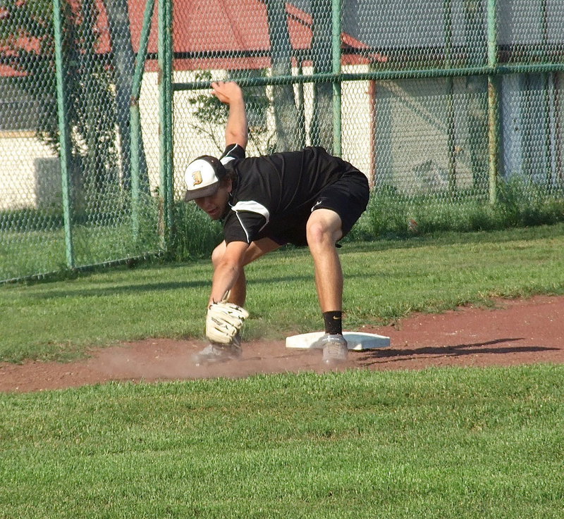 Image: Cole Hopkins gets down on a low ball.