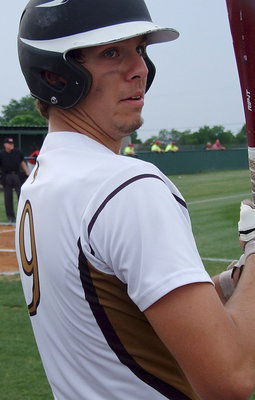 Image: Senior Cole Hopkins(9) gets loose in the batter’s circle.