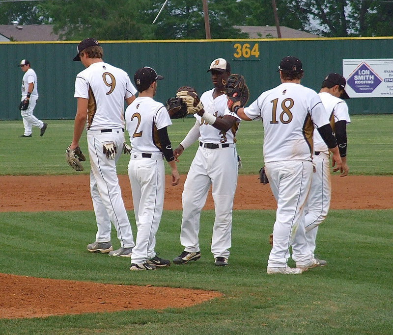Image: Infielders Cole Hopkins(9), Marvin Cox(3), John Byers(18) and Reid Jacinto(5) visit the mound in support of pitcher Caden Jacinto(2).