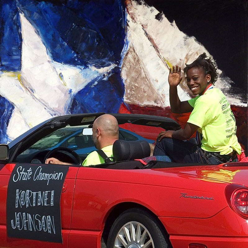 Image: The star of stars, Italy’s Kortnei Johnson, celebrates being a two-time State champion while being escorted by Italy HS principal Lee Joffre during the parade held in downtown Italy. The parade honored Johnson and her fellow student-athletes that have wrapped up the 2013 school year in successful fashion.