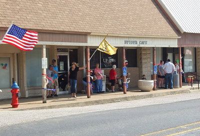 Image: Gladiator fans gather along Main Street in downtown Italy and in front of the Uptown Cafe, owned and operated by Doris Mitchell, that has been such a big supporter of Italy ISD over the years.