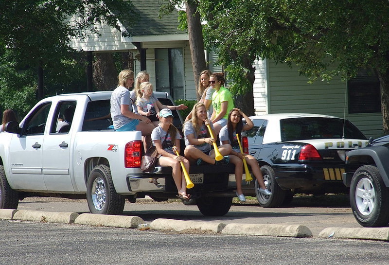 Image: Lady Gladiator softball players Madison Washington, Kelsey Nelson (Holding little Hannah Rowe), Bailey Eubank, Morgan Cockerham, Hannah Washington, Jaclynn Lewis and Ashlyn Jacinto are still smiling all the way to the end.