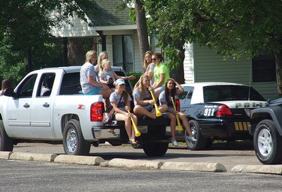 Image: Lady Gladiator softball players Madison Washington, Kelsey Nelson (Holding little Hannah Rowe), Bailey Eubank, Morgan Cockerham, Hannah Washington, Jaclynn Lewis and Ashlyn Jacinto are still smiling all the way to the end.