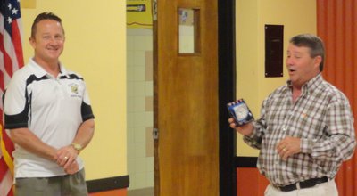 Image: Jon Mathers gets clock from Larry Eubank