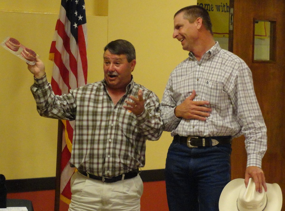 Image: Curtis Riddle gets “steaks” from Larry Eubank