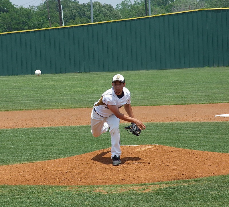 Image: Tyler Anderson(11) blocks everything else out while pitching.