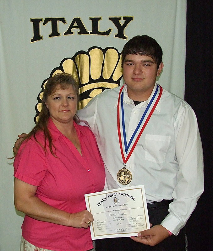 Image: Pictured with his proud mother, Flossie Gowin, senior Gladiator, Kevin Roldan, displays his State semifinal medal and certificate of achievement.
