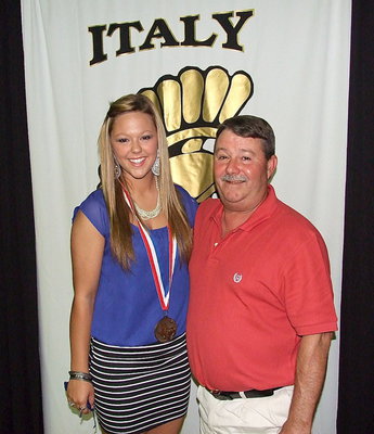 Image: Pictured with her father, Larry Eubank, sophomore statistician, Bailey Eubank, displays her State semifinal medal.