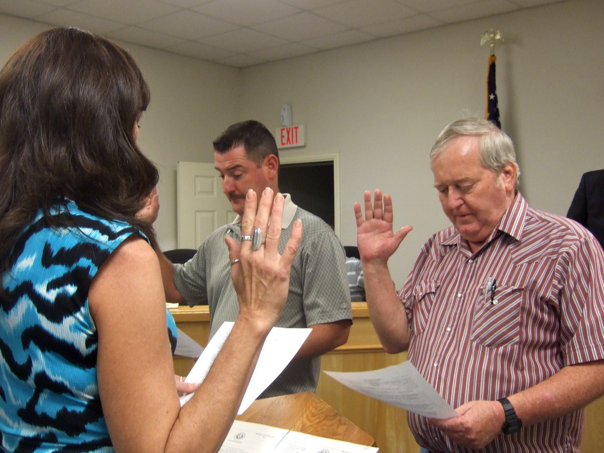 Image: Rodney Guthrie and Gregg Richards being sworn in for the office of city council.