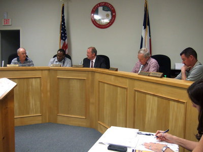 Image: Hobbs takes his seat as Mayor.