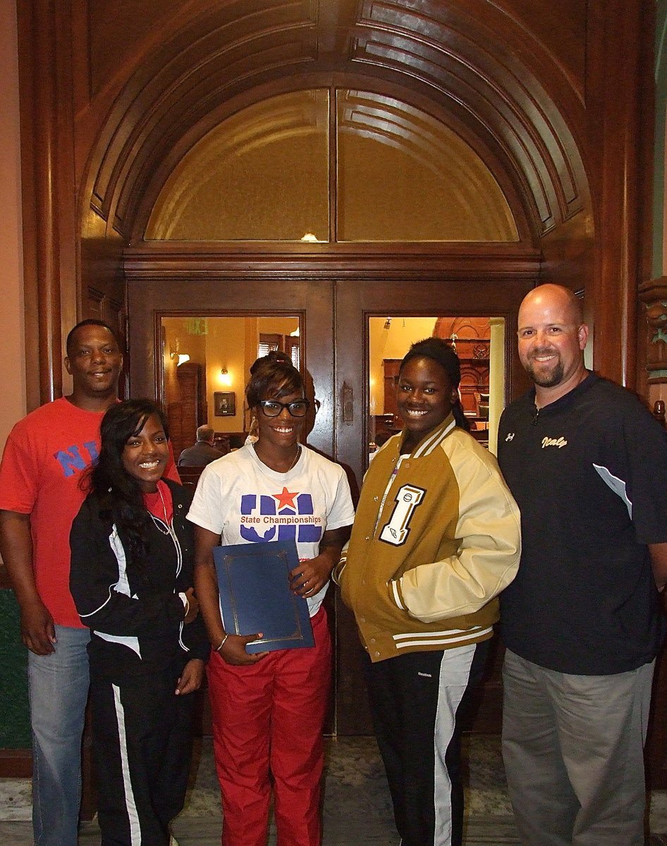 Image: James Johnson, the proud father of Kortnei Johnson, Kendra Copeland, Kortnei Johnson, Taleyia Wilson and Coach Hank Hollywood represent Italy High School and the Italy Athletic Department at the Ellis County Commissioners’ Court in Waxahachie.