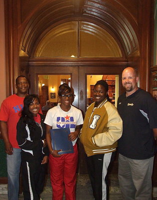 Image: James Johnson, the proud father of Kortnei Johnson, Kendra Copeland, Kortnei Johnson, Taleyia Wilson and Coach Hank Hollywood represent Italy High School and the Italy Athletic Department at the Ellis County Commissioners’ Court in Waxahachie.