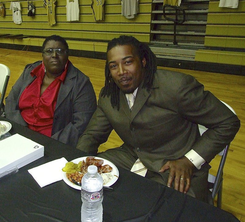 Image: Italy HS and CBI instructor Brenda Davis and her son Keith Davis, who is on hand to present the Keith Davis Award, enjoy the pre-ceremony meal catered by Texas Best Smokehouse of Italy.