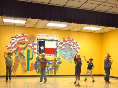 Image: These young cowboys sure can swing the rope!
