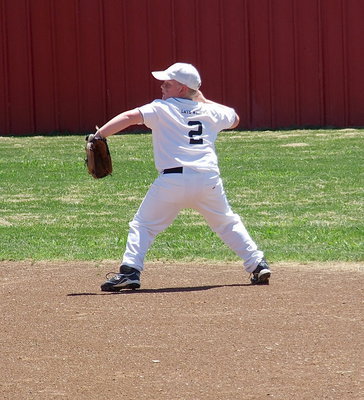 Image: Right fielder, Bryce Ballard(2) throws the ball into the infield after a Maypearl hit.