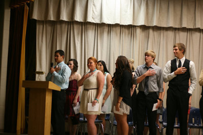Image: After the welcome, Reid Jacinto leads everyone to the Pledge of Allegiance.