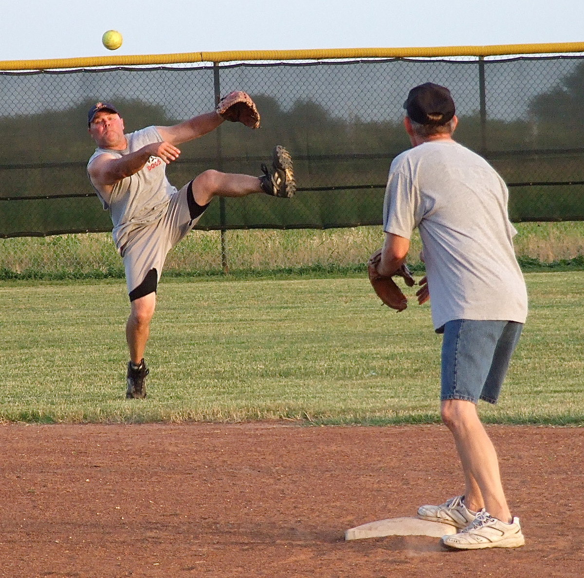 Image: Italy firefighter Jackie Cate turns two with Randy Boyd covering second during a practice session. When your hot, your hot!…