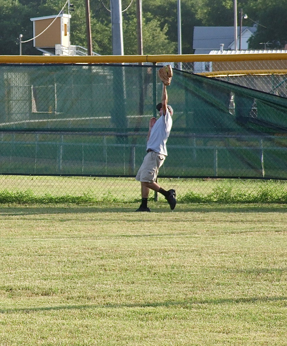 Image: Italy firefighter Brandon Jacinto needs no ladder to make this catch at the fence.
