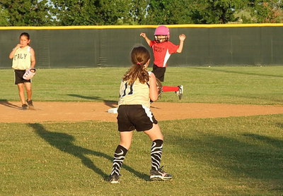 Image: Italy shortstop, Kinley Cate holds a Waxahachie runner at second base.