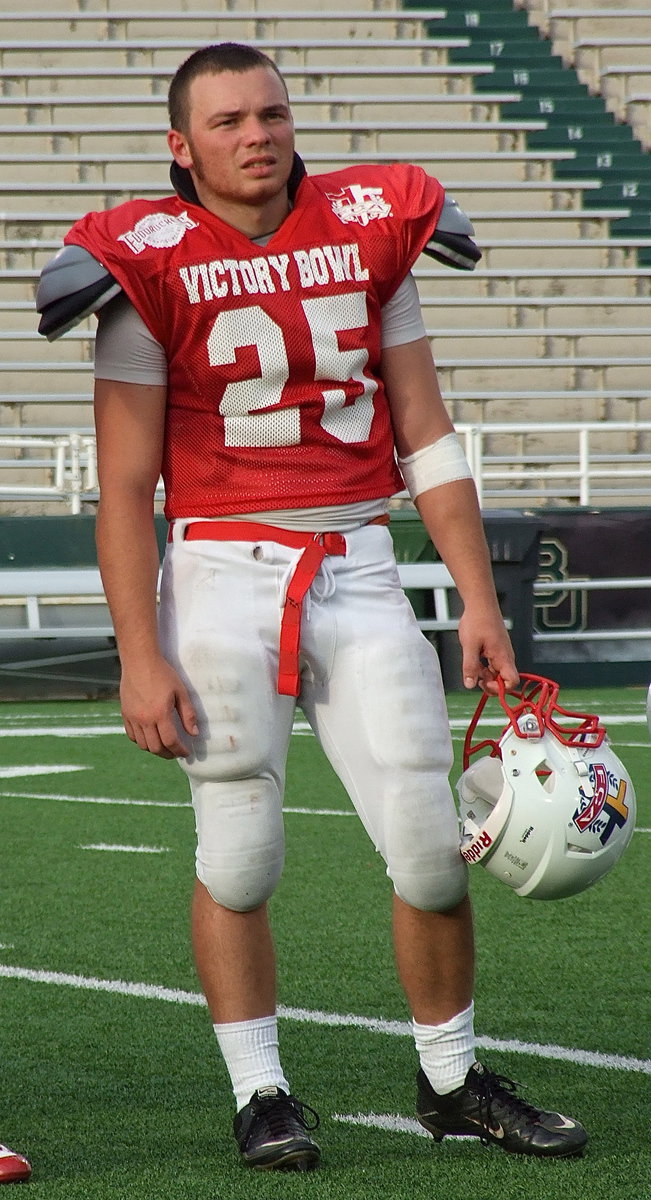 Image: Representing Avalon High School, the Avalon Eagle Football program and the FCA Victory Bowl V Red Team All-Stars is Reece Marshall, who is introduced to Floyd Casey Stadium during a halftime presentation.