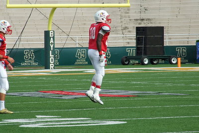 Image: Italy’s Ryheem Walker(10) is hyped for another kickoff after the Red Team regained a 7-3 lead.