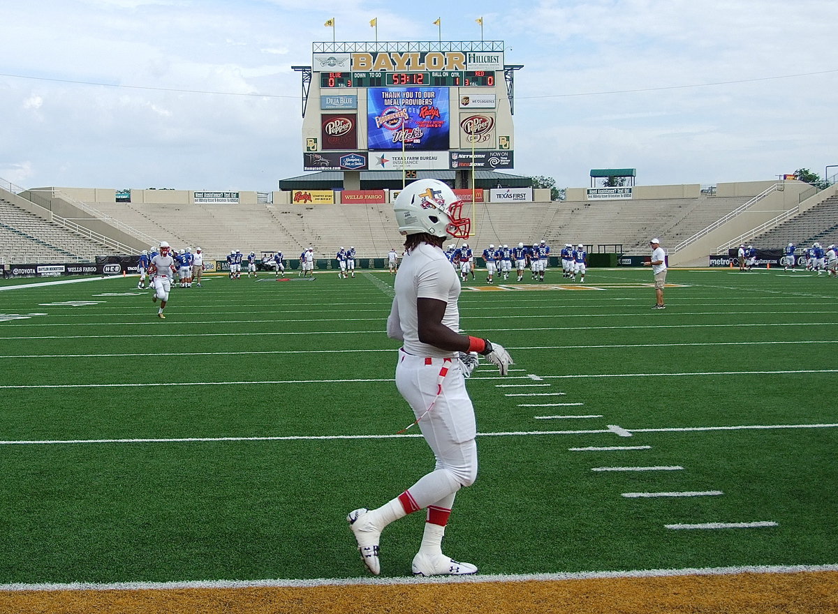 Image: Italy Gladiator and Red Team all-star, Ryheem Walker, is ready to put it all on the line as he takes the field during the pre-game warmup.