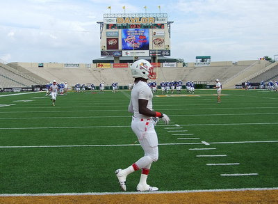 Image: Italy Gladiator and Red Team all-star, Ryheem Walker, is ready to put it all on the line as he takes the field during the pre-game warmup.
