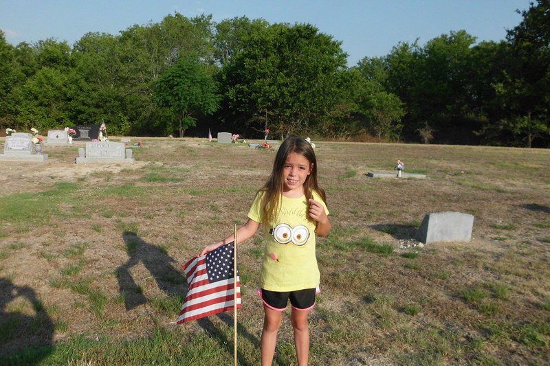Image: Morgan Chambers learns community service at the Italy Cemetery.
