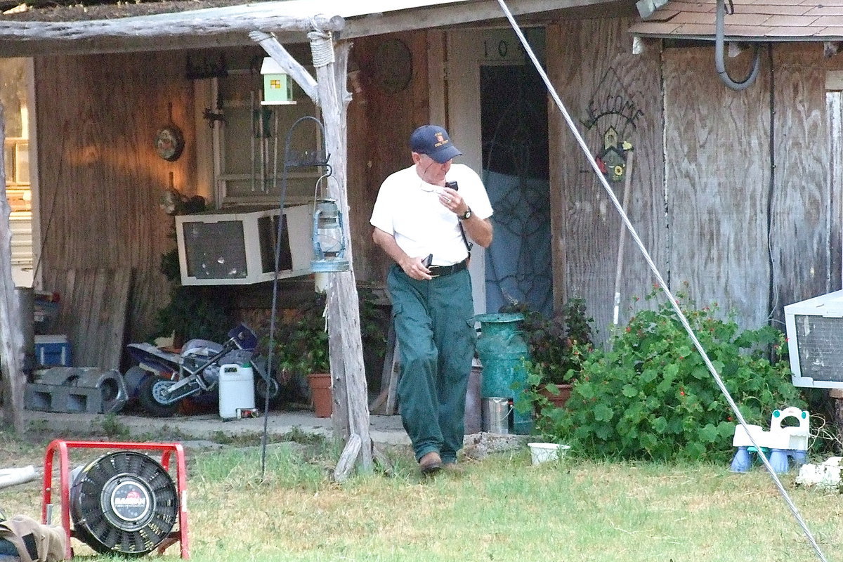 Image: Chief Donald Chambers, gives the all clear after checking the temperature inside the home one last time.
